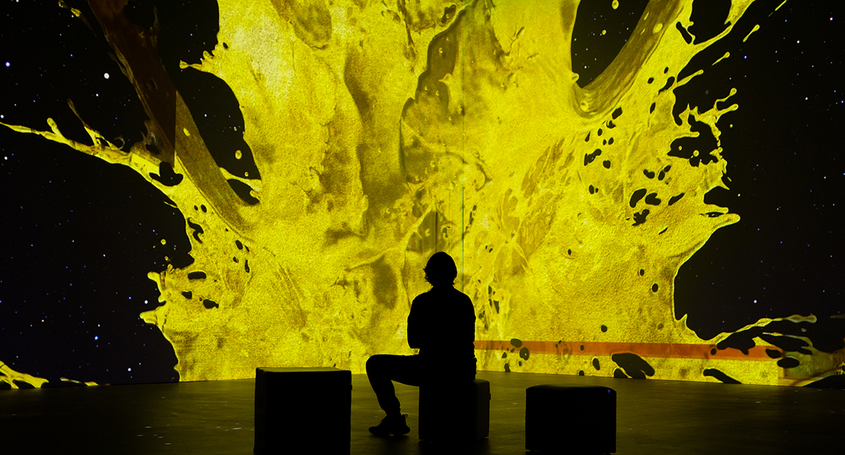 Man watching the Klimt Immersive Experience in a gallery setting